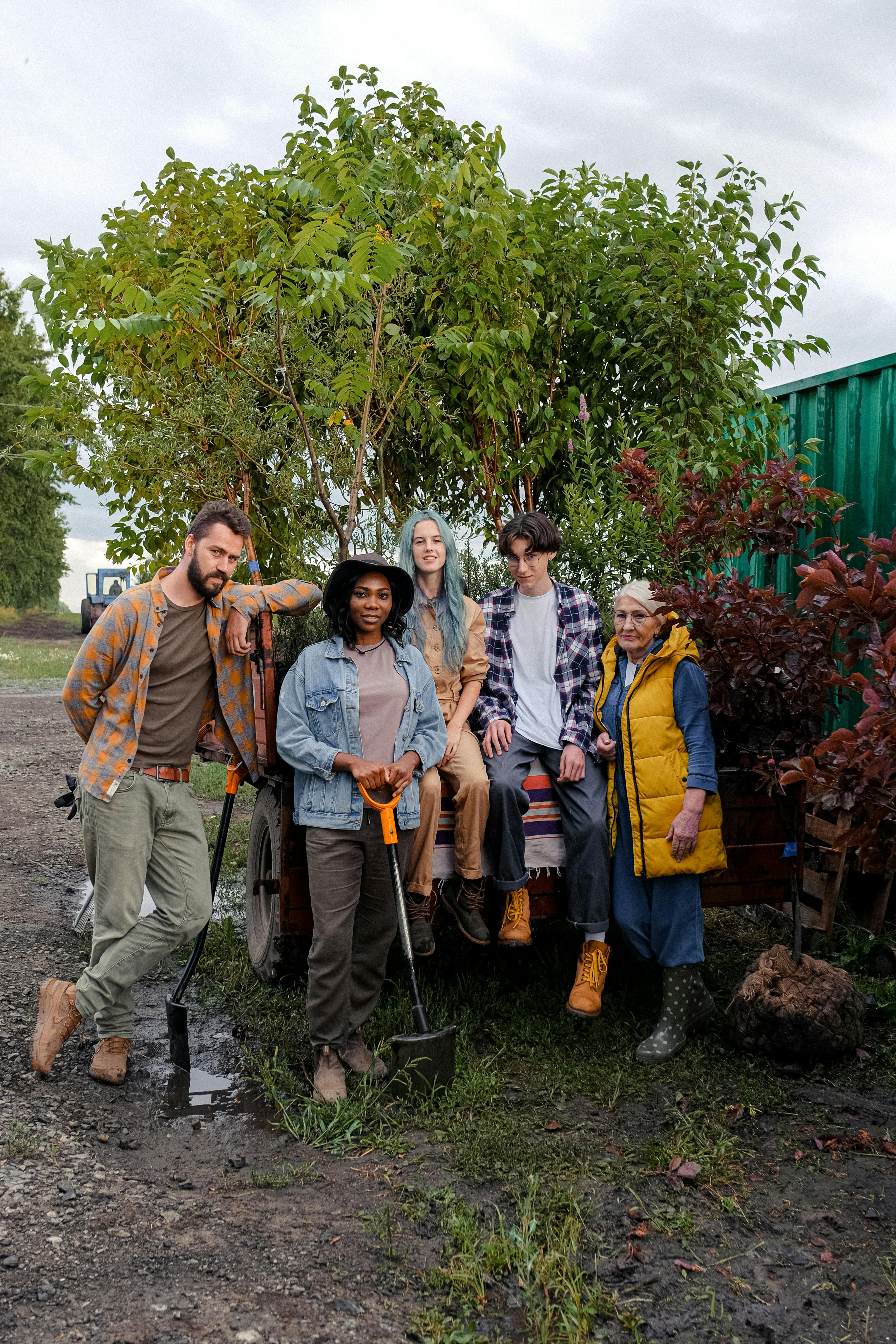 A group of gardeners standing outside with their shovels.
